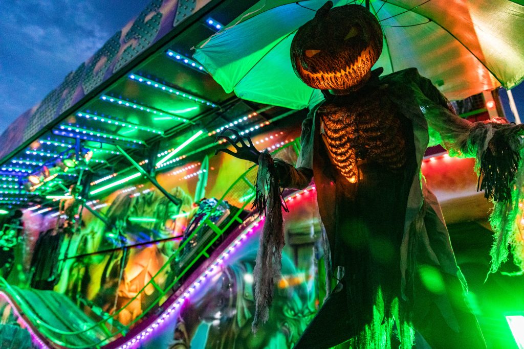 Spooktacular at Silverburn with a man with a Jack o' Lantern head in the foreground. 